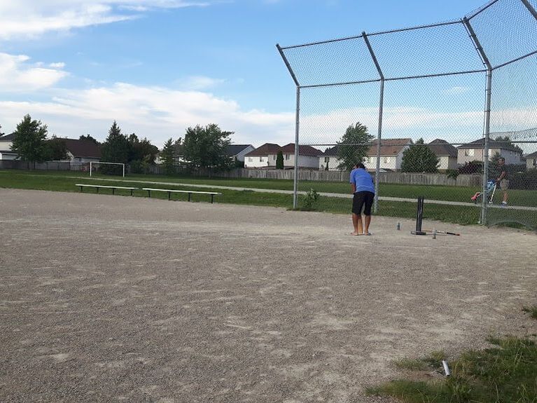Person playing baseball at Sault Park in East Hespeler Cambridge Ontario