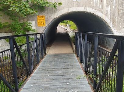 walkway leading to bridge in Morva Rouse Park, Cambridge Ontario